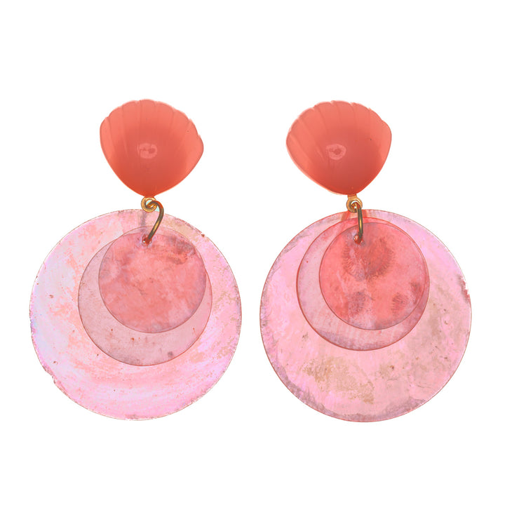 Hängande hockeyörhängen med snäckskal