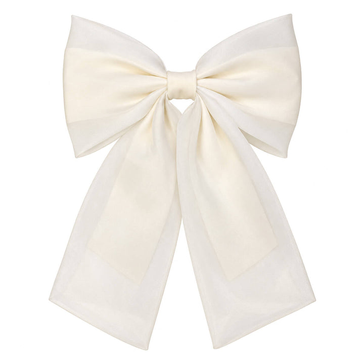 A sleek, lace-like hair bow with a clasp