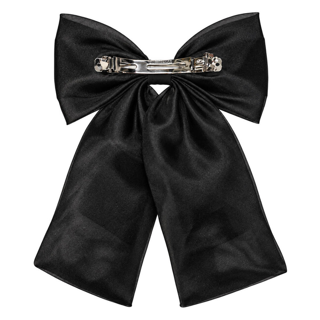 A sleek, lace-like hair bow with a clasp