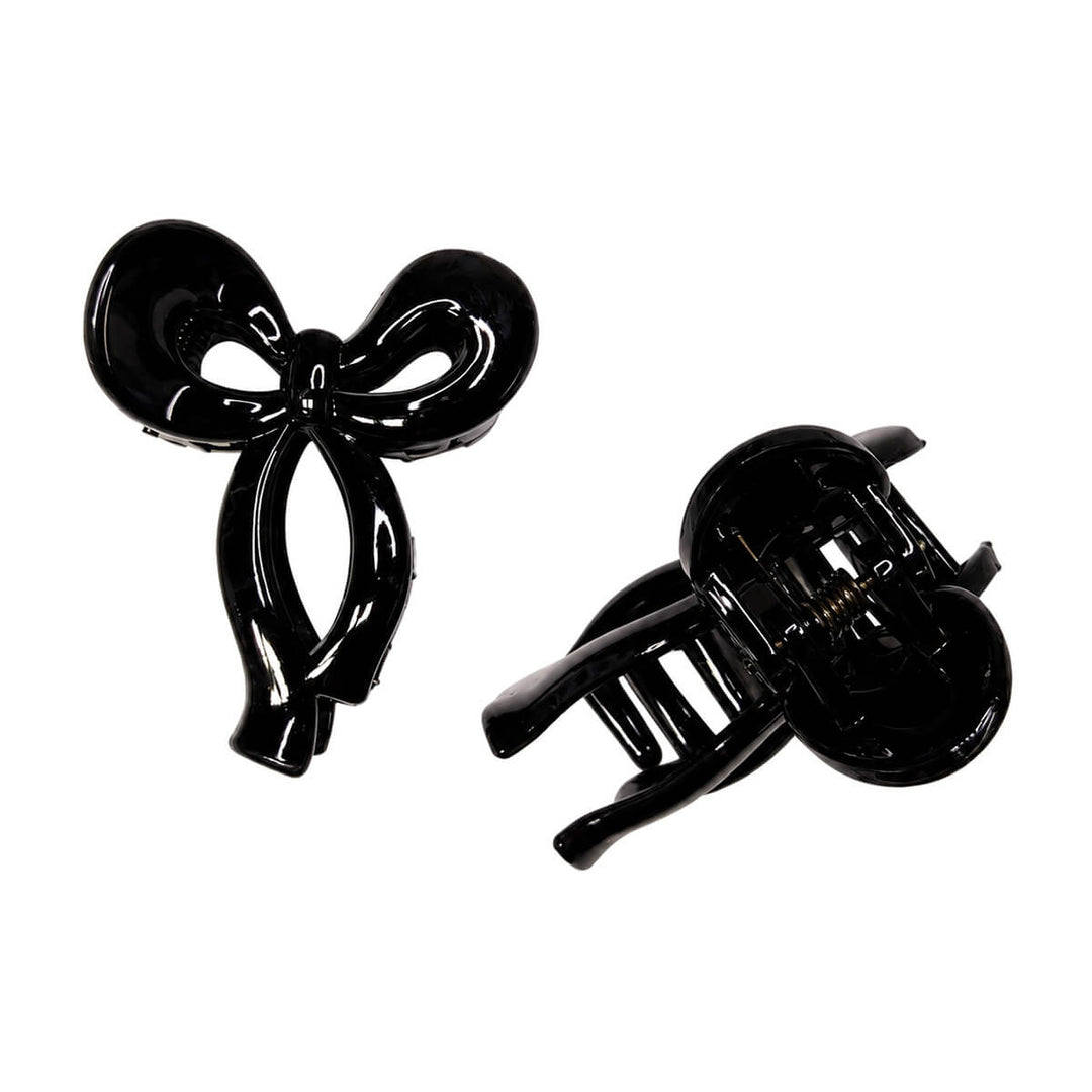 Small plastic bow-tie and shark-tooth hair clips, set of 2