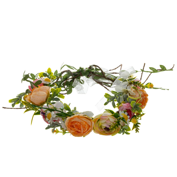 En krans av persikrosa ängsblommor