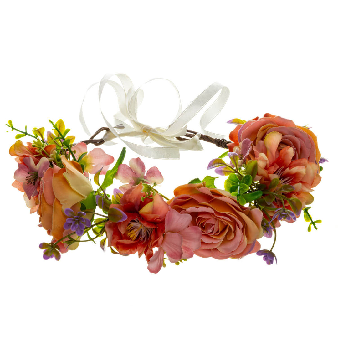 A soft peach-colored floral wreath with large flowers