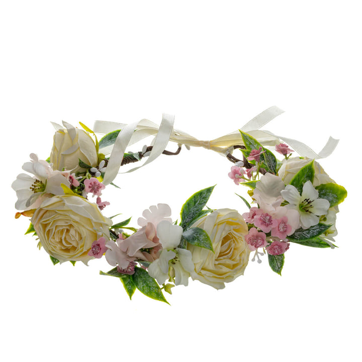 En vit roskrans med ljusrosa blommor