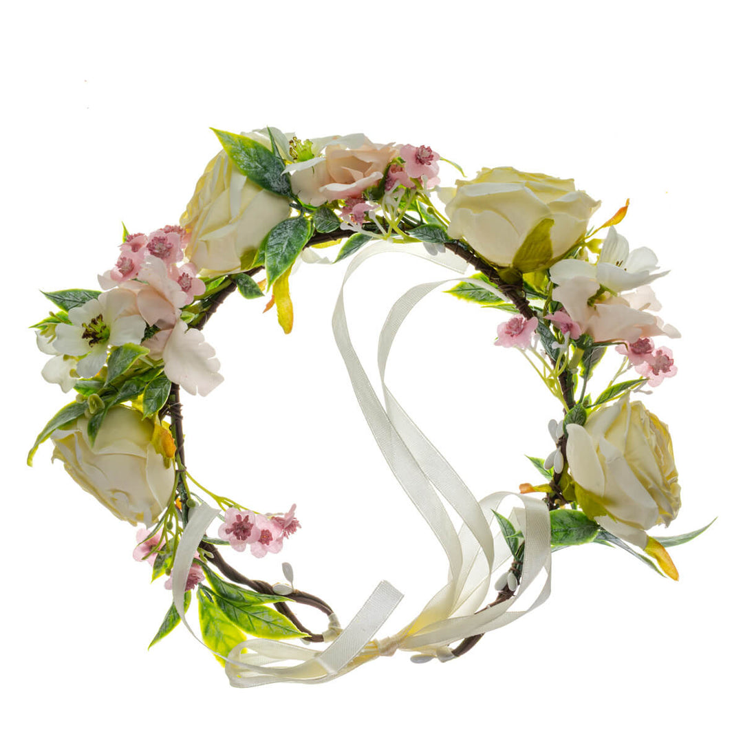 En vit roskrans med ljusrosa blommor