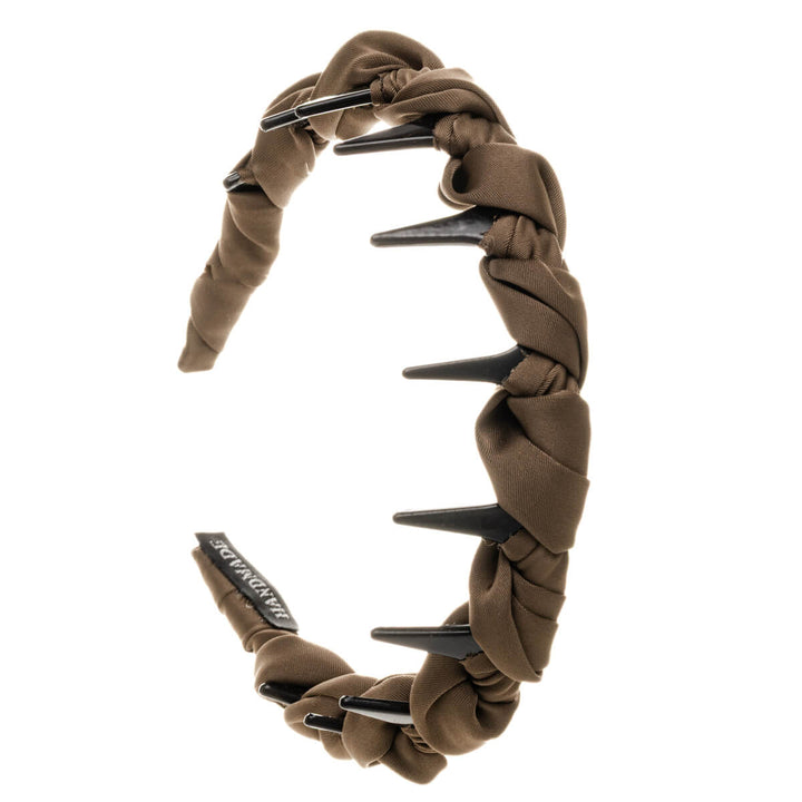 Plastiskt hårband dekorerat med satintyg