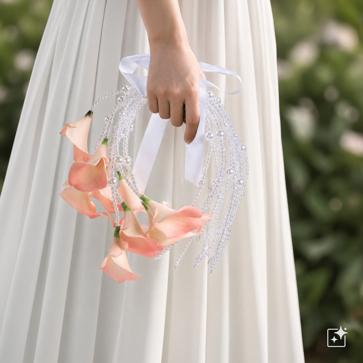 A calla lily bridal bouquet with a peach-colored artificial flower
