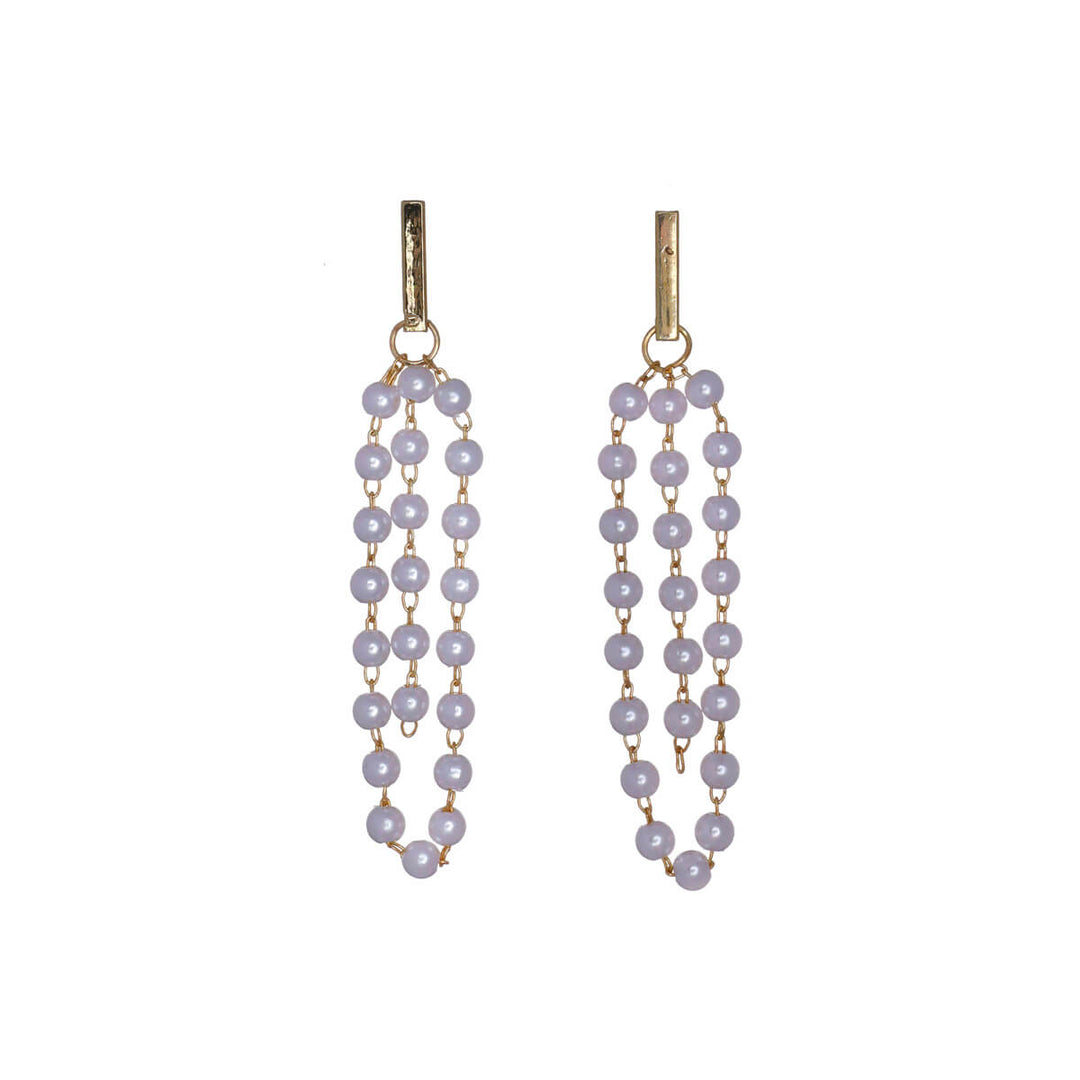 Hanging pearl earrings pillars