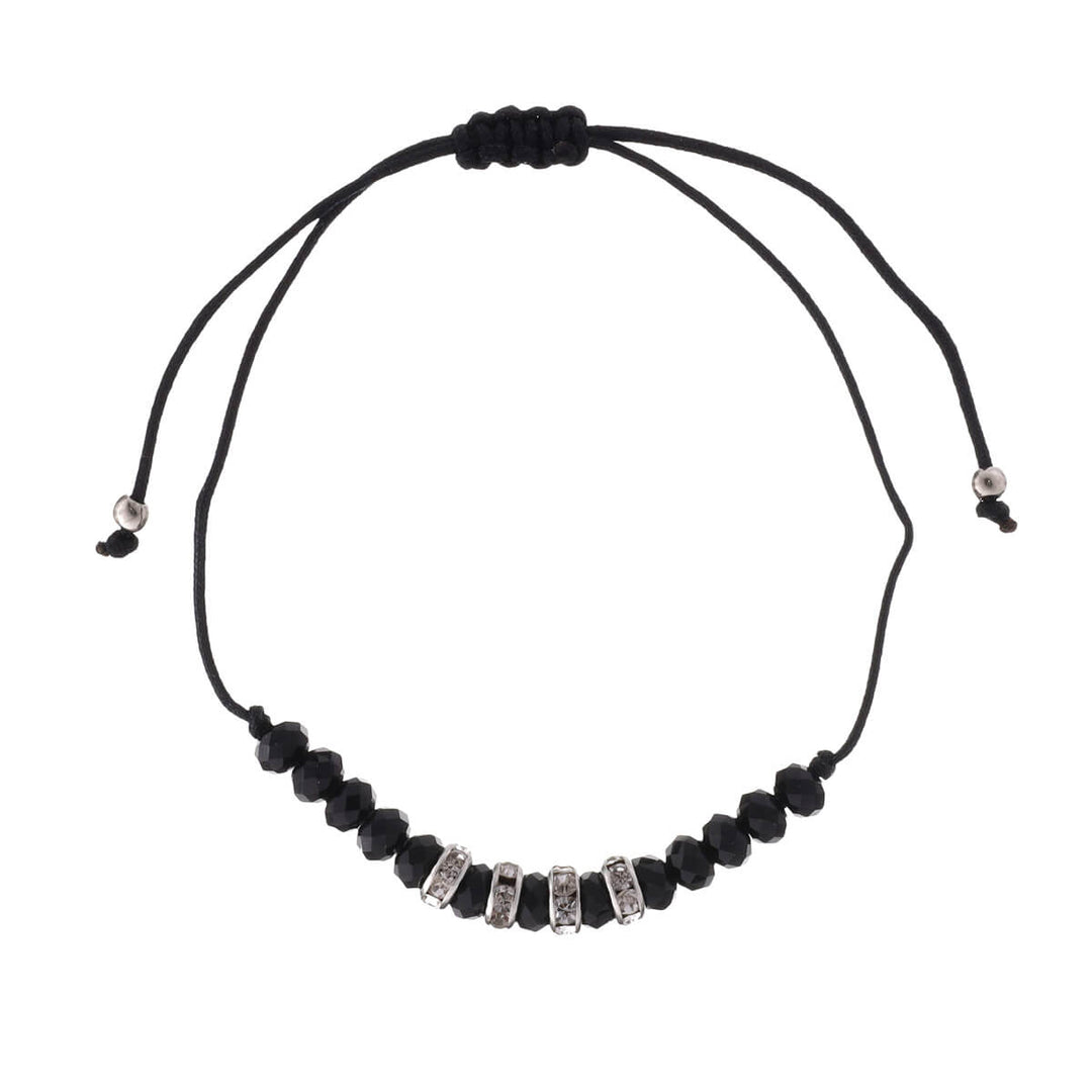 Ett tunt armband med glaspärlor