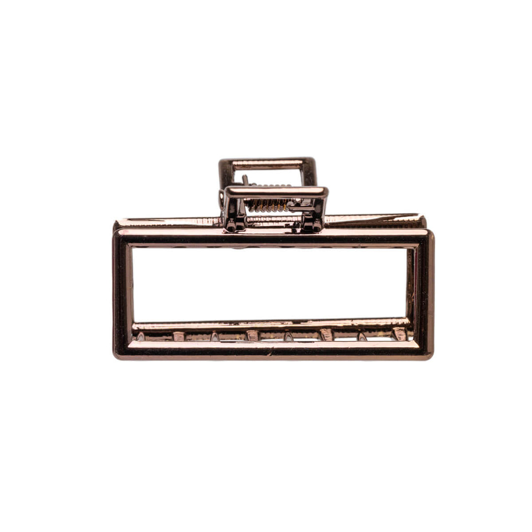 En liten rektangel av metallisk hajtandklipp 4,5 cm