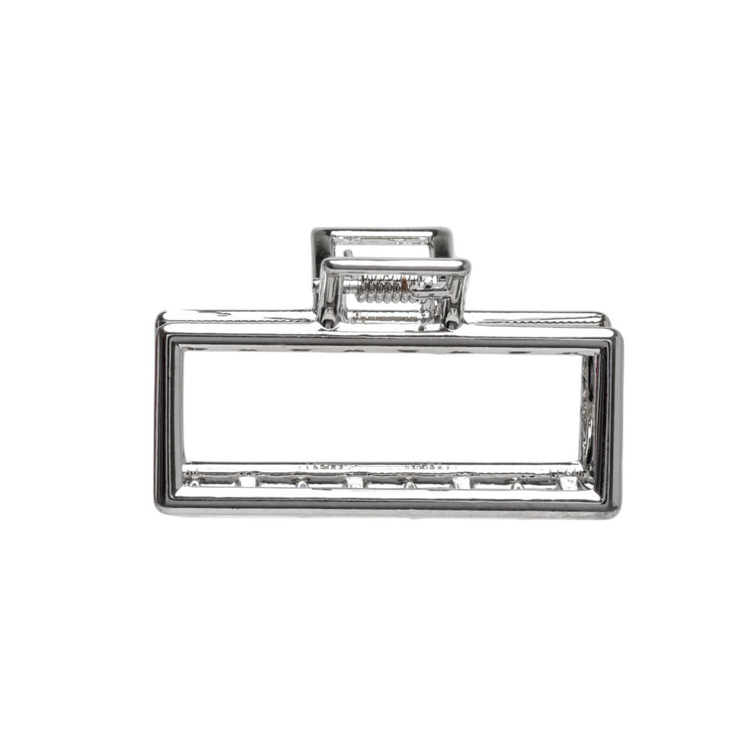 En liten rektangel av metallisk hajtandklipp 4,5 cm
