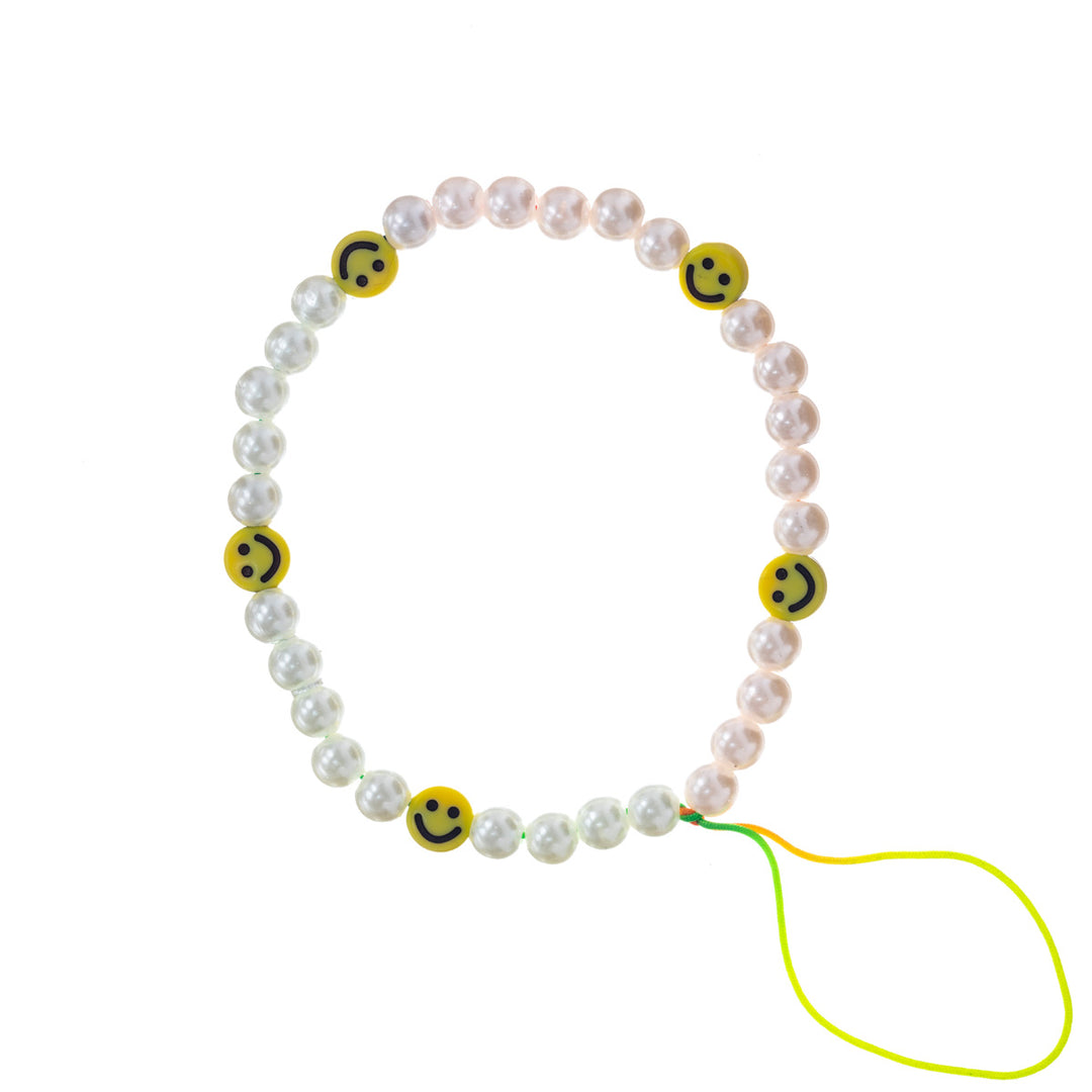 Pearl armband med leende dekorationer